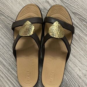 Crocs Women's Black and Gold Sandals